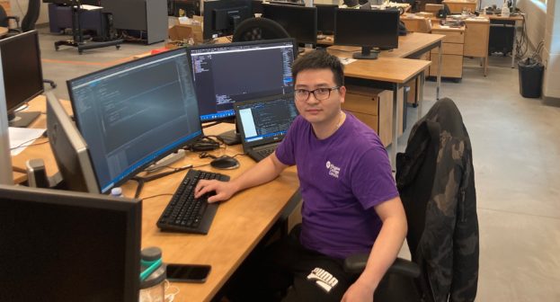 Ba Binh Luong (pictured) at his workstation and Niagara College's Walker Advanced Manufacturing Innovation Centre.