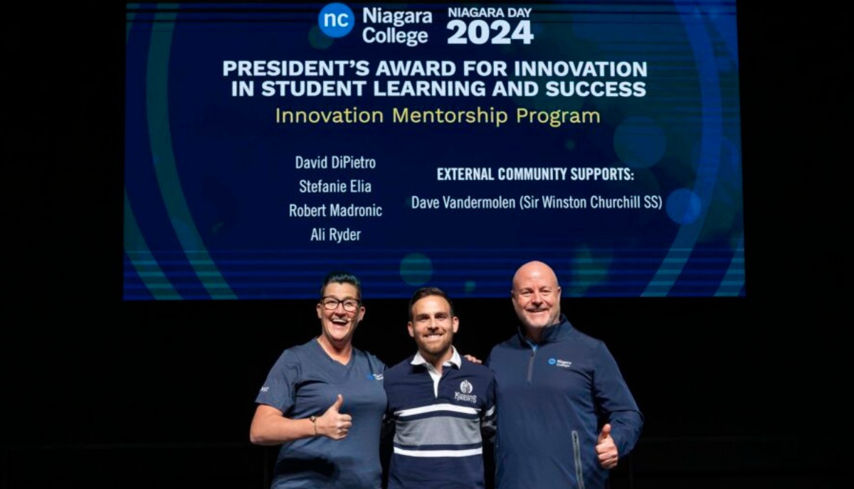 David DiPietro, Research Innovation, receives President's Award onstage for "Innovation in Student and Learning Success" at Niagara Day 2024.