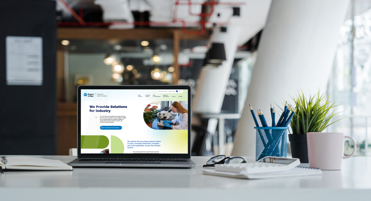 http://ncinnovation.ca%20-%20website%20homepage%20displayed%20on%20a%20laptop%20in%20a%20modern%20office.