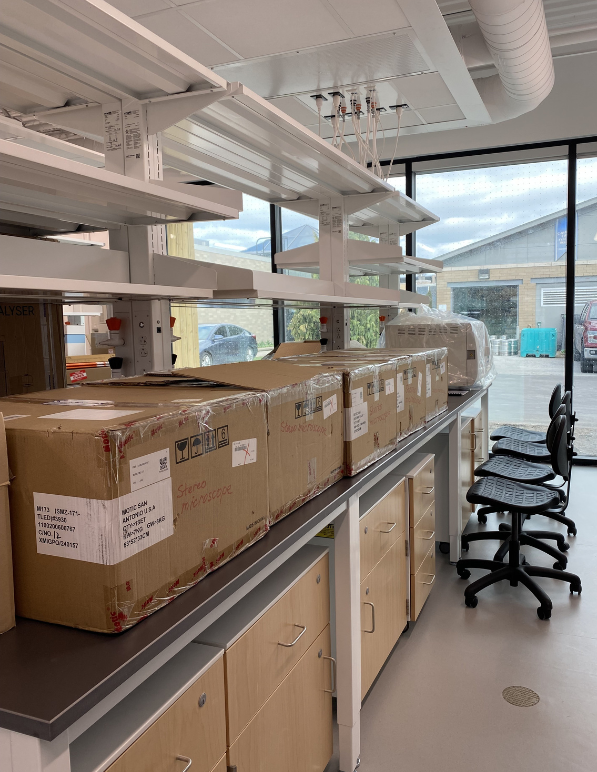 Microscope boxes in new HESIC lab to be opened.