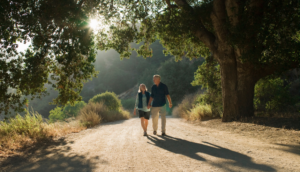 Couple holding hands on a walk in country.