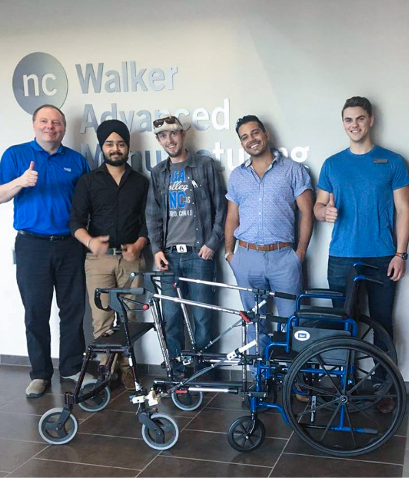 WAMIC and Bisep team pictured in front of their ARMM wheelchair device.